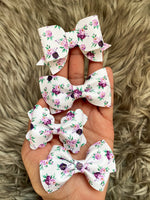 Gorgeous purple floral bows in many different styles!