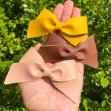 Beautiful solid colour smooth faux leather Lucy bows!