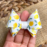 Beautiful bright and summery lemon print faux leather bows!