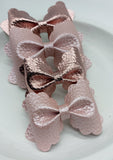 Classic and elegant pink pearl or metallic scalloped pinch bows!