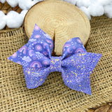Purple and periwinkle sun, rain and rainbow bows!