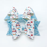 Adorable blue glitter and penguin print bows!