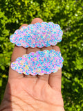 Adorable scalloped snap clips in pretty marbled mermaid scales or sparkly bubble glitters!