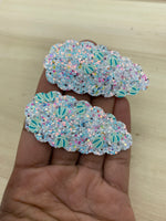 Fun scalloped snap clips in pretty prints and sparkly glitters!