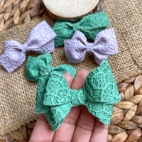 Embossed floral lace bows