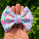 Adorable pink and purple floral bullet fabric bow clips or headbands.