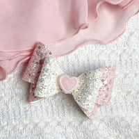 Gorgeous ivory and pink glitter bows with heart detail, perfect for Valentine's Day!