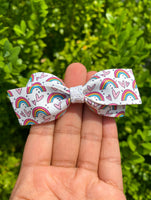 Sweet and modern rainbow and heart print bows!