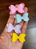 Small pigtail bow clips in pretty pastel colours