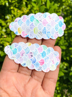 Adorable scalloped snap clips in pretty marbled mermaid scales or sparkly bubble glitters!