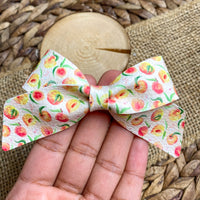 Sweet and summery peach print faux leather bows!