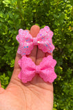 Super sparkly bright pink chunky glitter bows