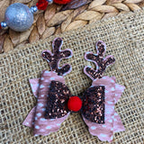 Adorable spotted fawn faux leather and sparkly glitter reindeer bows, perfect for Christmas!