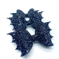 Super sparkly and spooky black glitter bat bows!