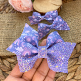 Purple and periwinkle sun, rain and rainbow bows!