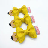 Adorable faux leather or chunky glitter pencil bows!