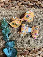 Gorgeous delicate floral and mustard bows!