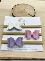 Set of three coordinating baby bow headbands in beautiful neutral colours
