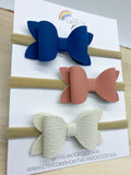 Set of three coordinating baby bow headbands in beautiful neutral colours