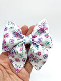 Gorgeous purple floral bows in many different styles!