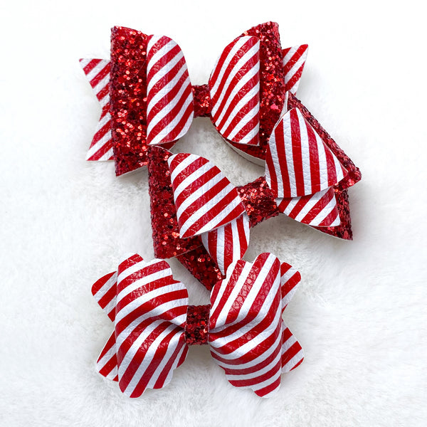 Adorable candy cane stripe bows, perfect for the holidays!