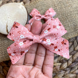 Beautiful pink, red and white floral bows!