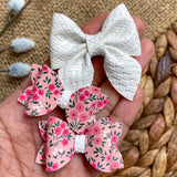 Adorable dainty pink and white floral pigtail bows!