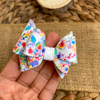 Gorgeous bright and happy rainbow floral bows!