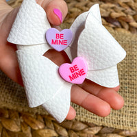 Adorable candy conversation heart bows, perfect for Valentine's Day!