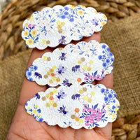 Pretty floral and bee faux leather or sparkly glitter snap clips.