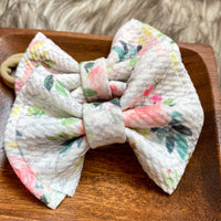 Muted pink and green floral bullet fabric bow clips or headbands.