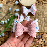 Sweet floral rainbows and basket weave faux leather bows, perfect for Easter!