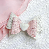 Gorgeous ivory and pink glitter bows with heart detail, perfect for Valentine's Day!