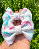 Adorable hearts and rainbows bullet fabric bow clips or headbands.