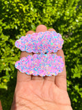 Adorable scalloped snap clips in pretty marbled mermaid scales or sparkly bubble glitters!