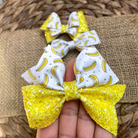 Bright and happy banana print and super sparkly glitter bows