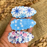 Adorable scalloped snap clips in perfect patterns for winter or the Holidays!
