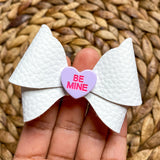 Adorable candy conversation heart bows, perfect for Valentine's Day!