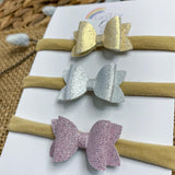 Set of three coordinating baby bow headbands in beautiful metallic neutral colours