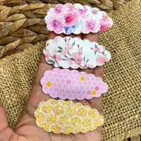 Pretty floral or honeycomb faux leather or sparkly glitter snap clips.