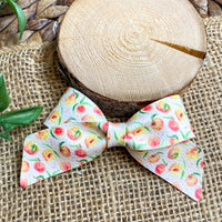 Sweet and summery peach print faux leather bows!
